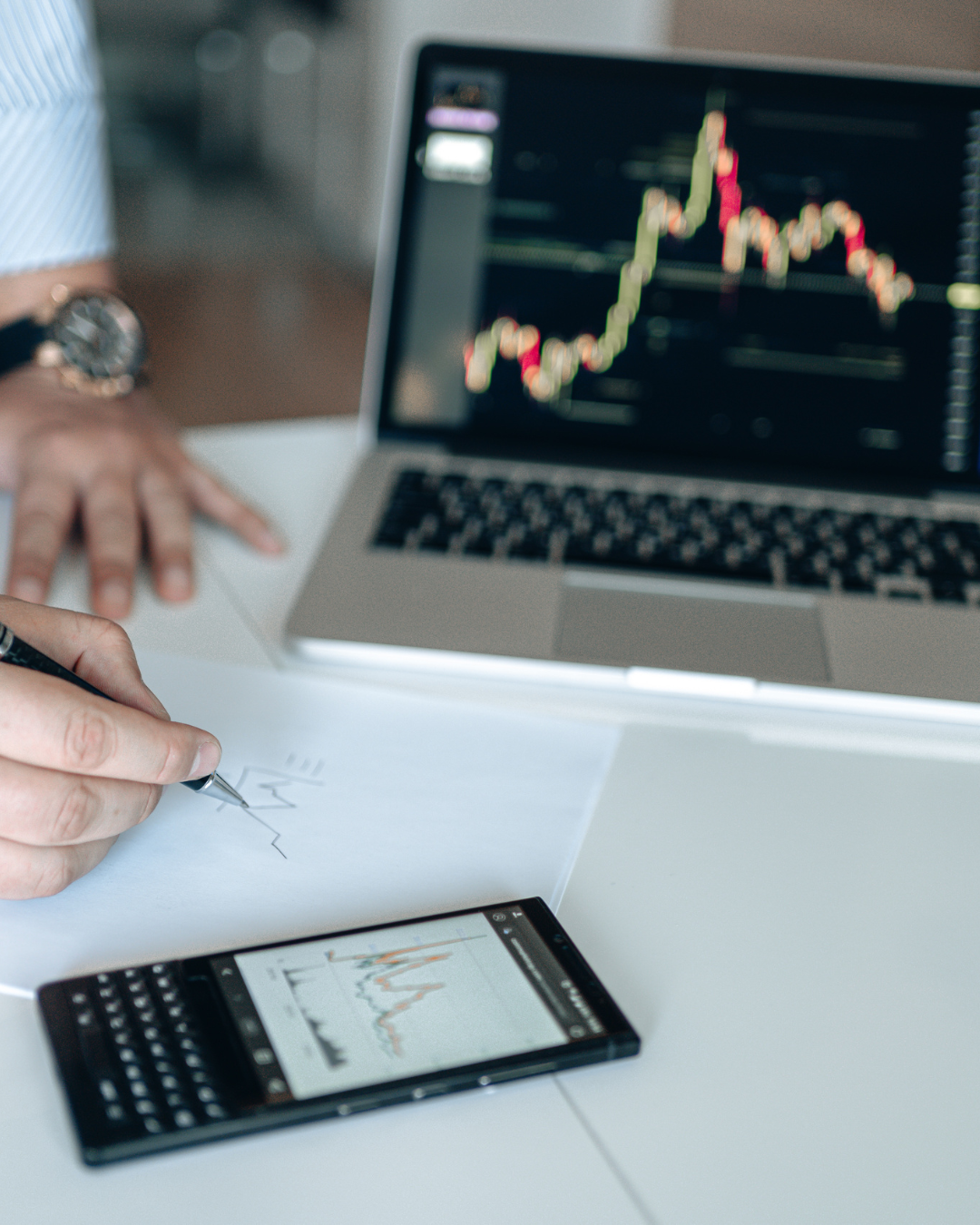 Restaurateur reviewing financial reports on a marble table